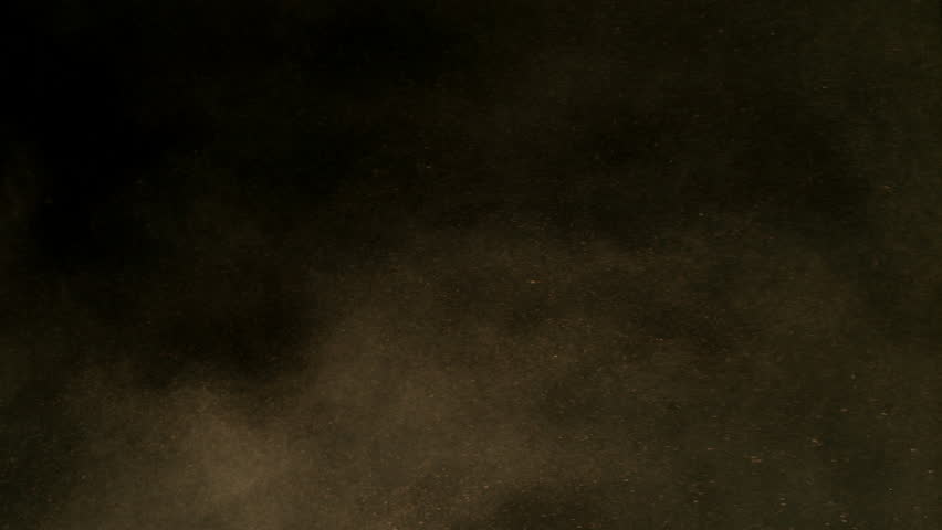 Super Slow Motion Shot of Flying Sand Powder , Isolated on Black Background , Filmed on High Speed Cinematic Camera at 1000 FPS