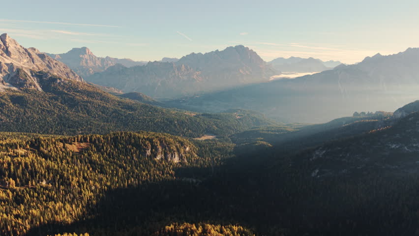 Scenic aerial view of Passo Giau mountain pass with Dolomites mountain and larch forest in autumn at Dolomites, Italy