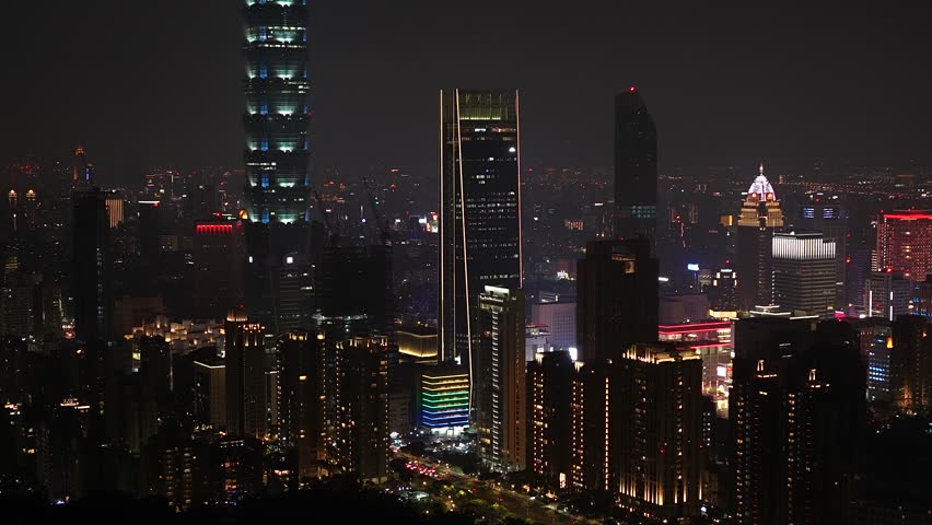Taipei 101 illuminating the urban skyline at night