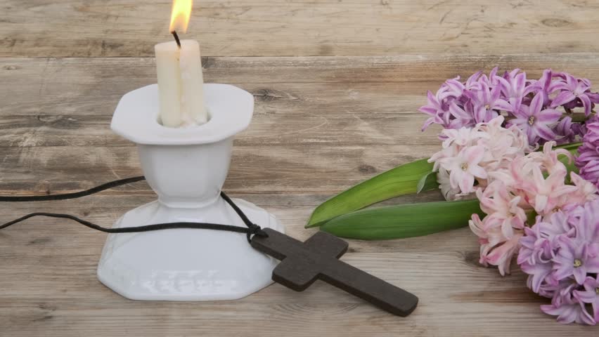 Wooden cross necklace with spring hyacinths, Easter, faith, and spring themes, resurrection and new life, Religious still life and flowers