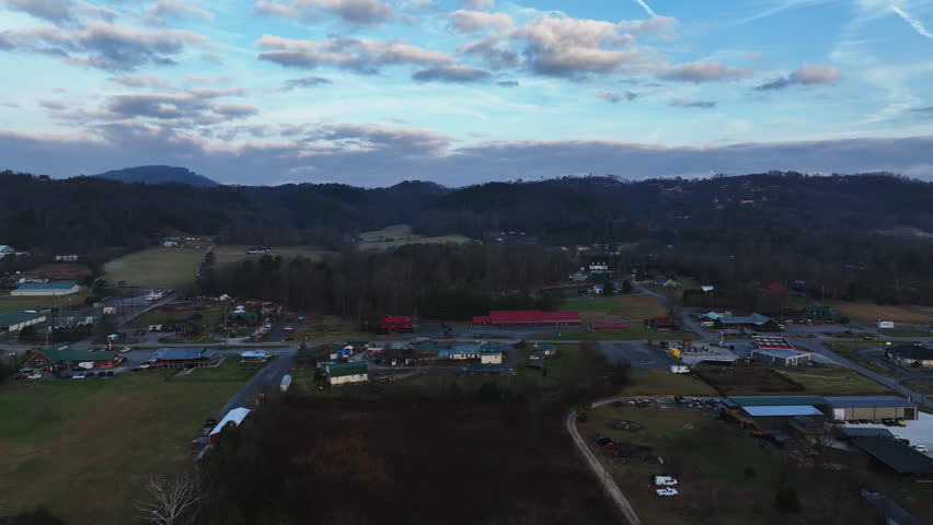 Early morning clouds and a blue sky create a tranquil drone flight around the Wears Valley in the Great Smoky Mountains of Appalachia