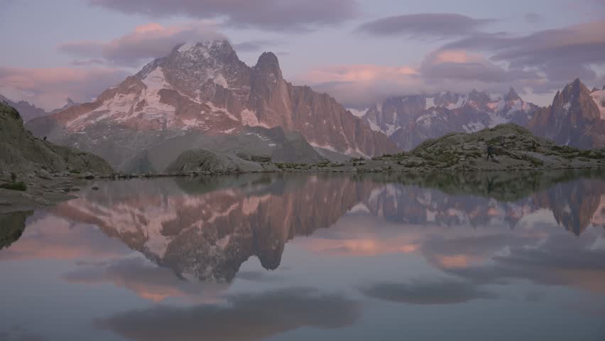 Golden sunset reflection on Lac Blanc with alpine mountains in the French alps