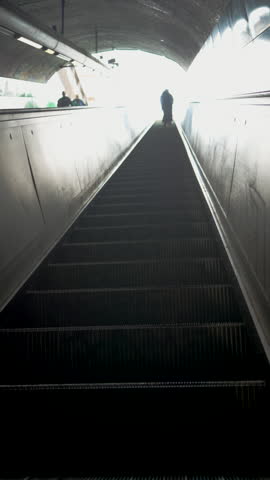 escalator from subway - stairway to success concept - vertical video 4k resolution
