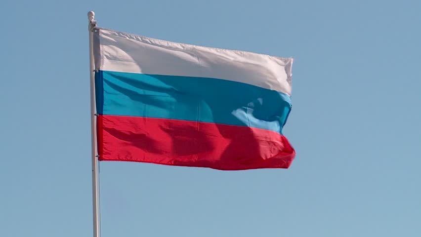 the flag of Russia on the background of blue summer