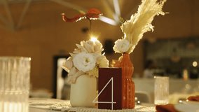 Intimate wedding centerpiece glowing with candlelight, wedding decor rustic gold backlight with pampas - Powered by Shutterstock - Get 15% off with code: PIKWIZARD15