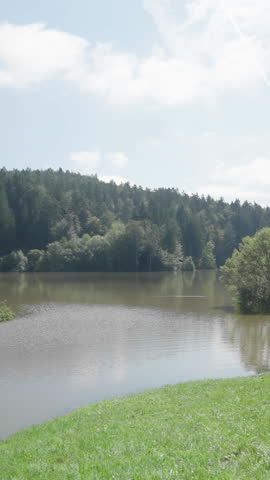 Walking towards the lake flooded landscape with trees under water