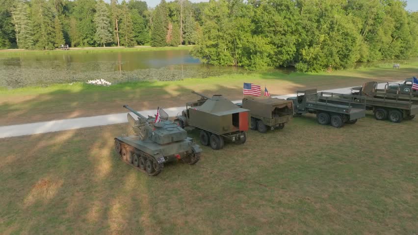 Aerial view of a convoy of vintage American military vehicles, showcasing historic USA army equipment, exhibition, and military heritage display.