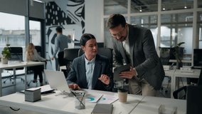 Caucasian businesswoman company leader boss consulting businessman manager showing digital tablet data asking help business man and woman discussing portable wireless computer tasks two office agents - Powered by Shutterstock - Get 15% off with code: PIKWIZARD15