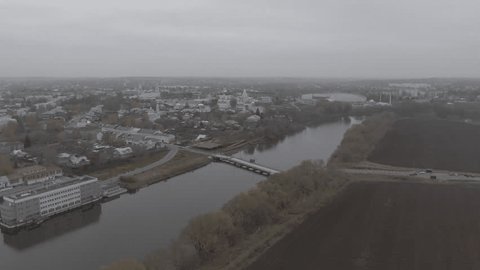 Drone Flying above River toward Kolomna Churches