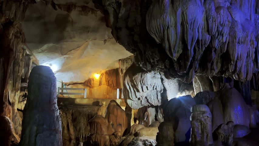 Wang Vieng, Laos.Tham Jang Cave-stalactites and stalagmites in a karst mountain with a Buddha temple inside. There is a spring inside the cave. The cave is equipped with comfortable paths and lanterns