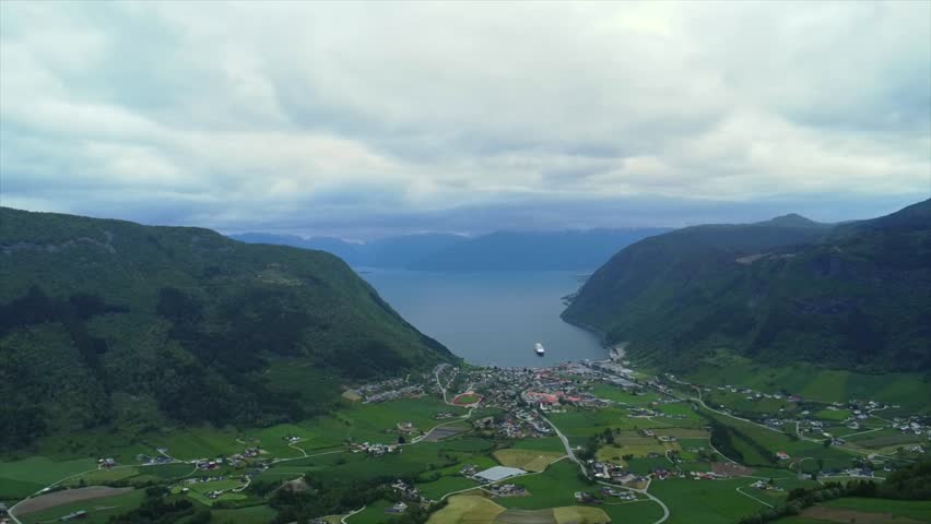 Scenic Norwegian fjord landscape with green mountain range