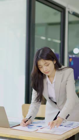 Female accountant working on financial investment on calculator, calculation, analysis of company income.
