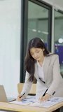 Female accountant working on financial investment on calculator, calculation, analysis of company income. - Powered by Shutterstock - Get 15% off with code: PIKWIZARD15