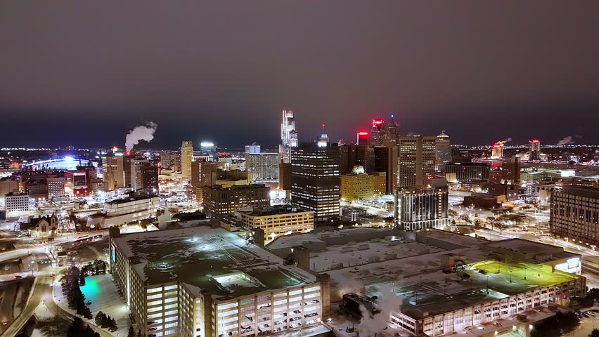 Detroit downtown skyline glowing brightly at night, capturing modernity and urban life, USA