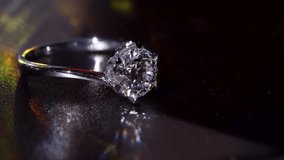 Shimmering Diamond Ring is Shown in Deep Dramatic Macro Composition. Highlighting Its Precise Facets and Polished Metal Finish. Timeless Symbol of Elegance, Luxury and Masterful Beauty Craft Design 4k - Powered by Shutterstock - Get 15% off with code: PIKWIZARD15
