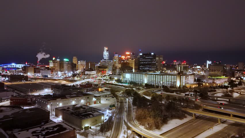 Detroit, Michigan downtown skyline illuminating city during winter night in aerial view