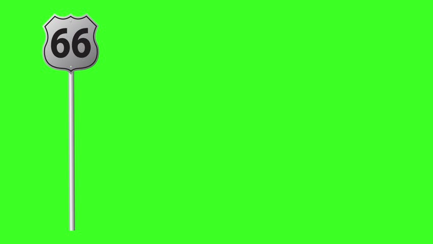A blank, silver shield-shaped road sign stands on a metal pole against a vibrant green screen chroma key background. This isolated footage is perfect for compositing and adding custom text or graphics for travel, direction, or informational videos.