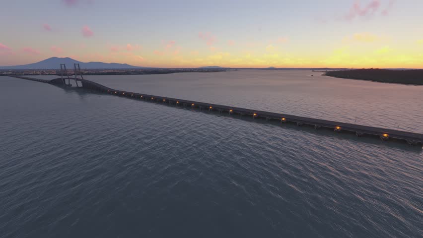 3D - Circular aerial drone shot at sunset of Suramadu Bridge in Jawa Timur Surabaya. Indonesia