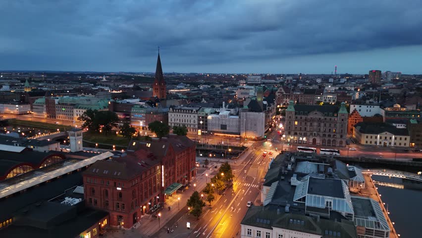 Evening serenity over Malmö’s harbor seen from a soaring drone	
