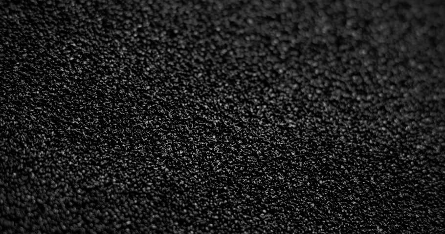 Slow diagonal shift of the background with asphalt texture.