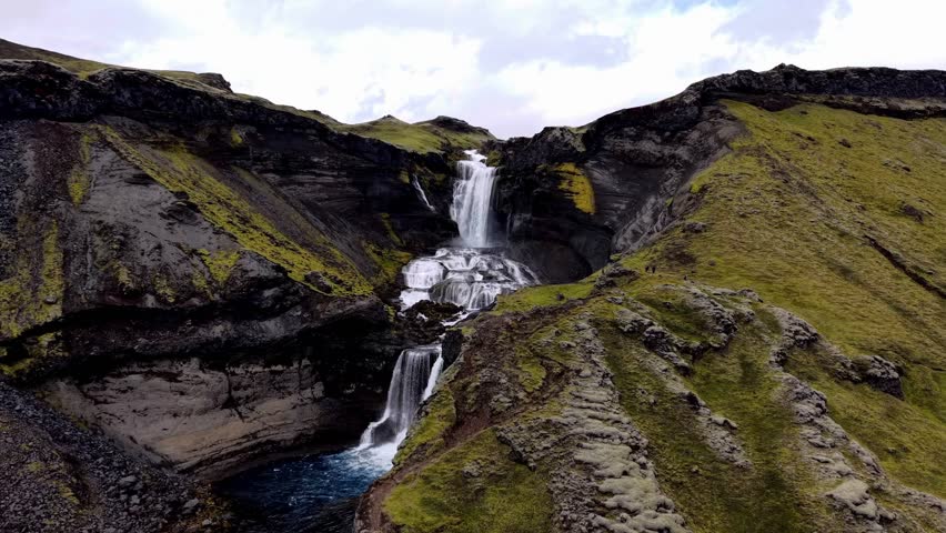 Aerial view of waterfall cascading down rocks, Iceland.