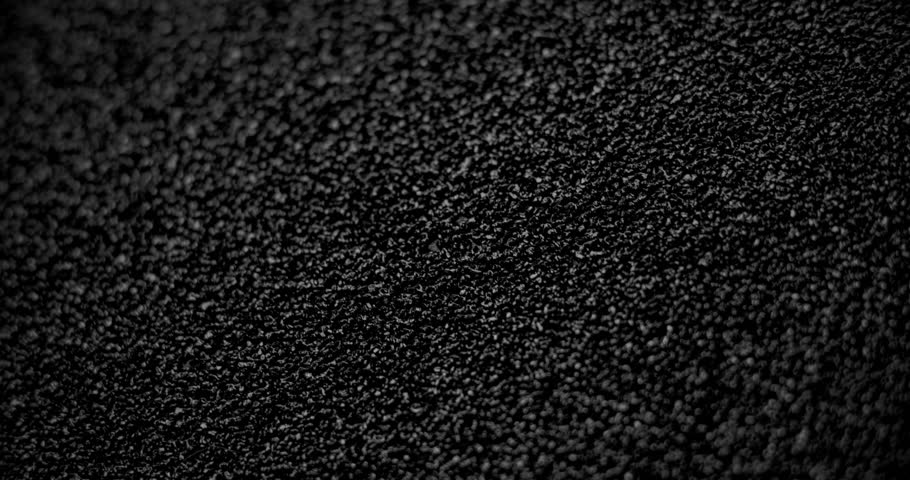 Slow diagonal shift of the background with asphalt texture.