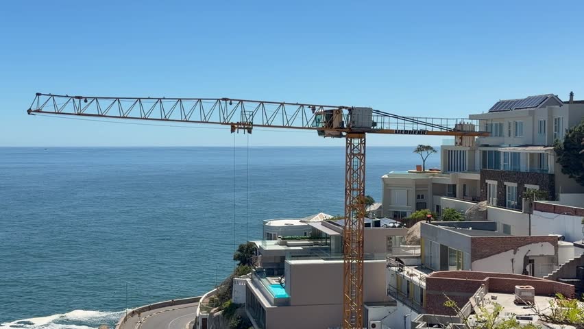 A construction crane along the coast of Cape Town, South Africa.