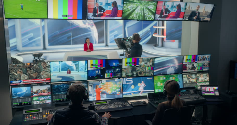 TV Station Production Control Room, Broadcast Professionals Run a Live News Program, Monitoring Multiview Screens, Switching Sources, Cueing Studio Cameras, Routing. Playout for Cable Network Channel