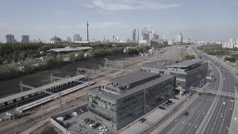 Drone Orbiting Moscow Business Center near Highway
