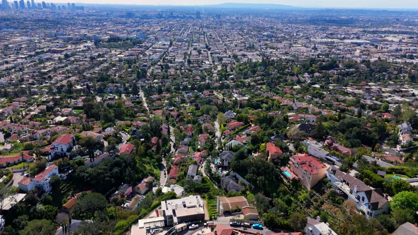 Los Angeles aerial view with downtown skyline and residential hills drone shot