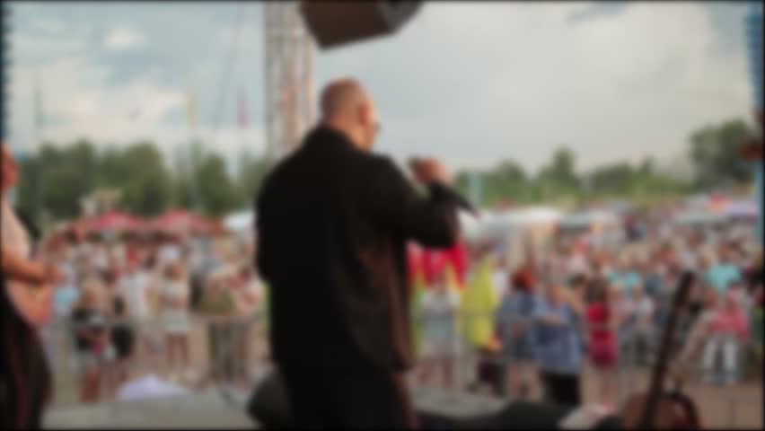 Crowd Watches Live Music Performance At Sunset.