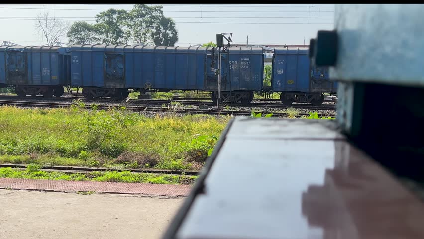 Railway track passing through scenic mountain landscape in Darjeeling