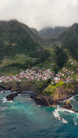 Aerial view of Seixal village on Madeira island, Portugal, with Atlantic Ocean and mountain landscape