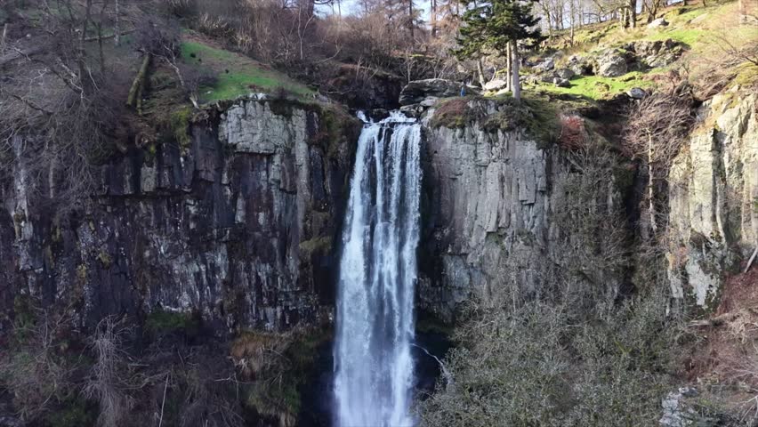 Spectacular Pistyll Rhaedr waterfall slo-mo in HDR by drone - slow pan descent from top, North Wales, UK