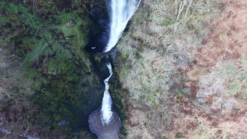 Spectacular Pistyll Rhaedr waterfall slo-mo in HDR by drone - slow pan rise from base, North Wales, UK
