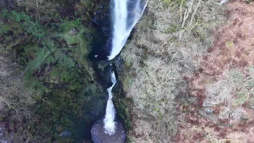 Spectacular Pistyll Rhaedr waterfall slo-mo in HDR by drone - very slow pan rise from base, North Wales, UK