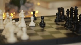 Close-up of woman and man playing chess, moving pieces on wooden board - Powered by Shutterstock - Get 15% off with code: PIKWIZARD15