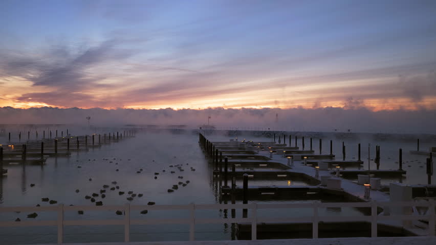Aerial Sunrise View of Sea Smoke and Port Washington Breakwater Light in Winter