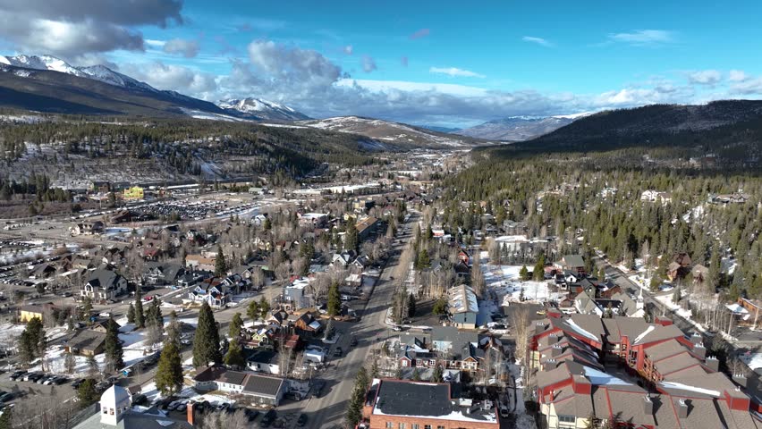 Aerial View of Snowy Breckenridge Town and Rocky Mountains, Sunny Day in Colorado