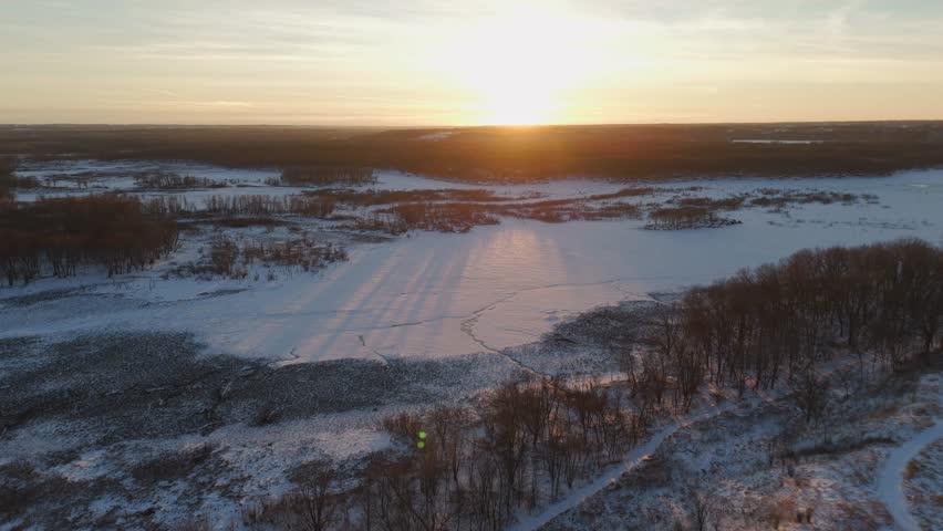 Sunset over Minnesota valley during winter, covered in snow during golden hour 6