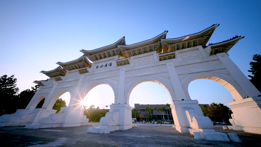 The majestic Liberty Square gate at the Chiang Kai-shek Memorial Hall in Taipei, Taiwan, captured during a beautiful golden hour sunset.