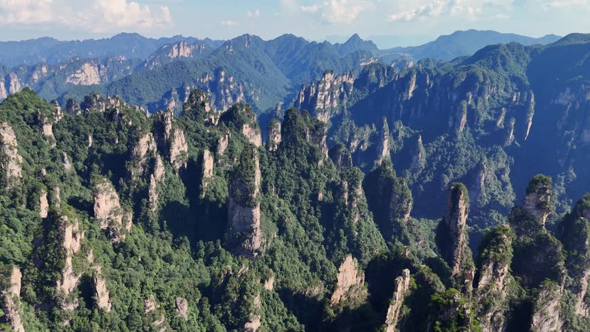 Iconic sandstone pillars in National Forest of Yuanjiajie Zhangjiajie China, aerial panoramic view