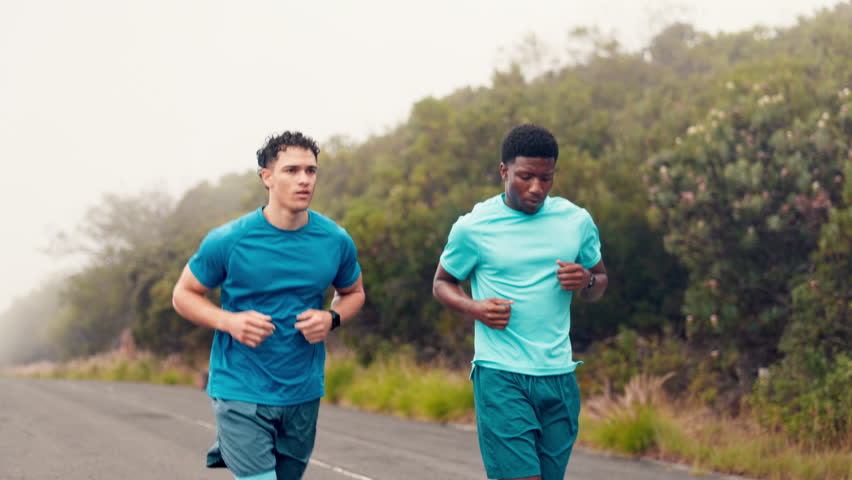 Fitness, men and running exercise in road for marathon practice, check watch and pace timer. Mist, runner team and stopwatch in nature for workout performance, endurance challenge and cardio progress