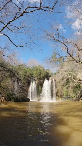 beautiful waterfall flowing through a lush green forest landscape
