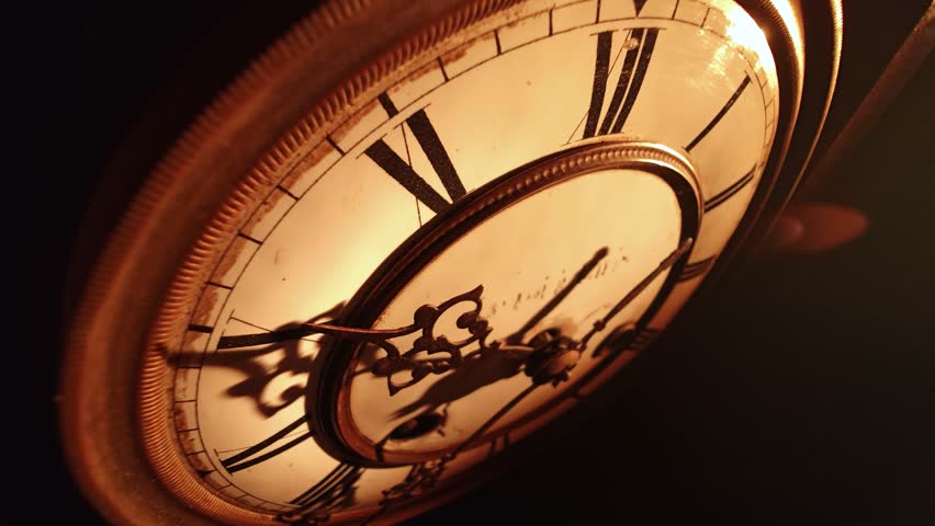 Vintage clock hands moving slowly