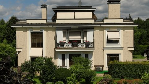 Aerial Drone Lowering toward Villa Facade