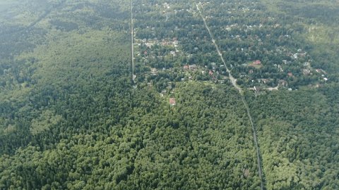 High Speed Forward Descent above Woodland Settlement