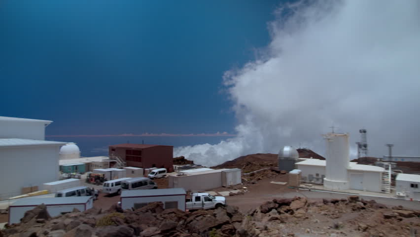Clouds moving over the astronomical observatories on the summit of Mauna Kea volcano in Hawaii