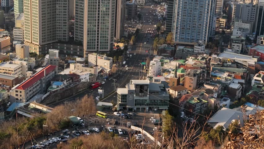 Elevated view of central Seoul city streets and apartments at sunset light