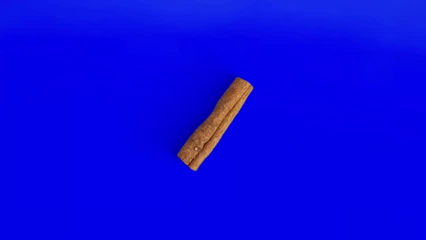 Cinnamon Stick Isolated on Blue Background 